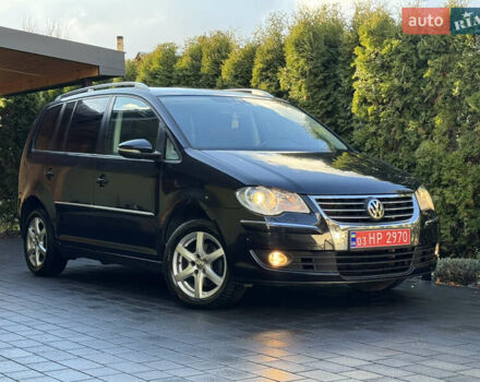 Черный Фольксваген Туран, объемом двигателя 1.4 л и пробегом 199 тыс. км за 7999 $, фото 1 на Automoto.ua