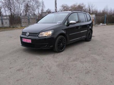 Черный Фольксваген Туран, объемом двигателя 1.4 л и пробегом 234 тыс. км за 8850 $, фото 1 на Automoto.ua