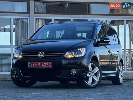 Чорний Фольксваген Туран, об'ємом двигуна 2 л та пробігом 200 тис. км за 11750 $, фото 1 на Automoto.ua