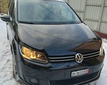 Черный Фольксваген Туран, объемом двигателя 2 л и пробегом 243 тыс. км за 11500 $, фото 1 на Automoto.ua
