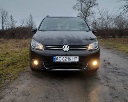 Черный Фольксваген Туран, объемом двигателя 1.4 л и пробегом 235 тыс. км за 9199 $, фото 1 на Automoto.ua