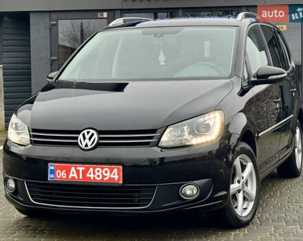 Черный Фольксваген Туран, объемом двигателя 2 л и пробегом 196 тыс. км за 14599 $, фото 1 на Automoto.ua