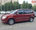 Красный Фольксваген Туран, объемом двигателя 1.4 л и пробегом 254 тыс. км за 6999 $, фото 2 на Automoto.ua