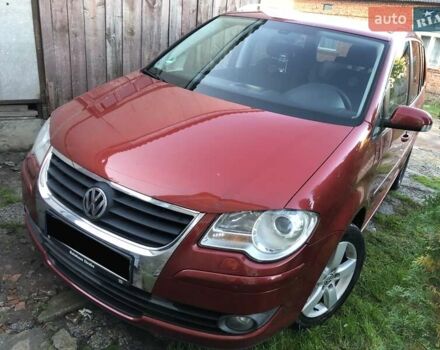 Червоний Фольксваген Туран, об'ємом двигуна 1.4 л та пробігом 241 тис. км за 7300 $, фото 1 на Automoto.ua