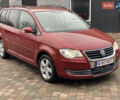 Красный Фольксваген Туран, объемом двигателя 1.4 л и пробегом 240 тыс. км за 7000 $, фото 1 на Automoto.ua