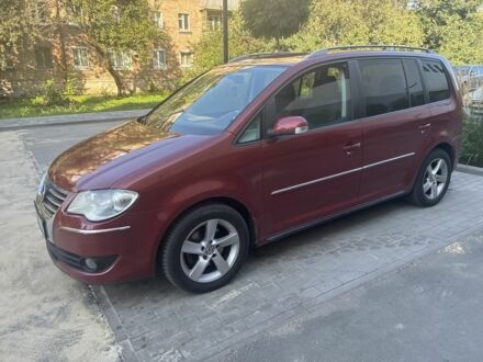 Красный Фольксваген Туран, объемом двигателя 2 л и пробегом 260 тыс. км за 6200 $, фото 1 на Automoto.ua