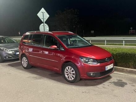 Красный Фольксваген Туран, объемом двигателя 1.4 л и пробегом 200 тыс. км за 10500 $, фото 1 на Automoto.ua