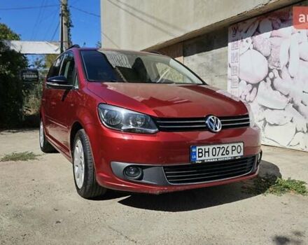 Красный Фольксваген Туран, объемом двигателя 1.6 л и пробегом 262 тыс. км за 8999 $, фото 1 на Automoto.ua