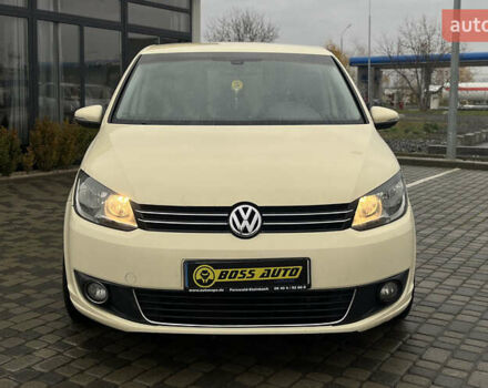Желтый Фольксваген Туран, объемом двигателя 1.97 л и пробегом 213 тыс. км за 8990 $, фото 1 на Automoto.ua