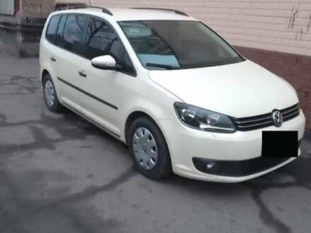 Желтый Фольксваген Туран, объемом двигателя 2 л и пробегом 320 тыс. км за 12500 $, фото 1 на Automoto.ua