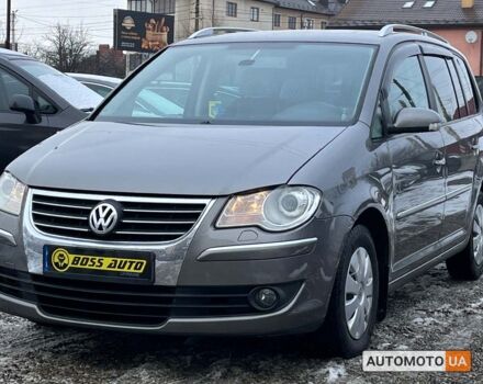 Серый Фольксваген Туран, объемом двигателя 1.4 л и пробегом 242 тыс. км за 7950 $, фото 2 на Automoto.ua