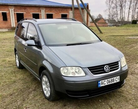 Серый Фольксваген Туран, объемом двигателя 2 л и пробегом 350 тыс. км за 5499 $, фото 1 на Automoto.ua