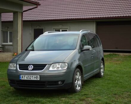 Серый Фольксваген Туран, объемом двигателя 2 л и пробегом 370 тыс. км за 4950 $, фото 1 на Automoto.ua