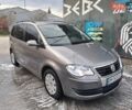 Серый Фольксваген Туран, объемом двигателя 1.39 л и пробегом 239 тыс. км за 5999 $, фото 1 на Automoto.ua