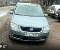 Серый Фольксваген Туран, объемом двигателя 1.4 л и пробегом 202 тыс. км за 5600 $, фото 1 на Automoto.ua