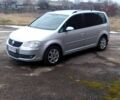 Серый Фольксваген Туран, объемом двигателя 1.9 л и пробегом 236 тыс. км за 6900 $, фото 1 на Automoto.ua