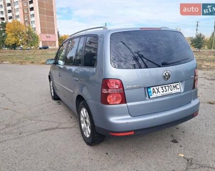 Серый Фольксваген Туран, объемом двигателя 1.4 л и пробегом 209 тыс. км за 6500 $, фото 2 на Automoto.ua