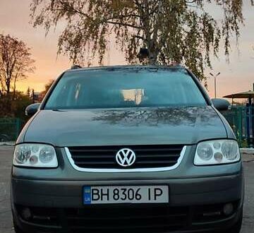 Фольксваген Туран 2005 в Черкассах на Automoto.ua Серый Фольксваген Туран, объемом двигателя 1.9 л и пробегом 254 тыс. км за 5950 $, фото 1 на Automoto.ua