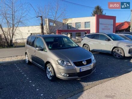 Серый Фольксваген Туран, объемом двигателя 1.4 л и пробегом 233 тыс. км за 5400 $, фото 1 на Automoto.ua
