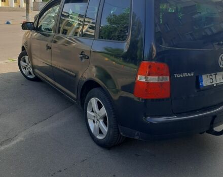 Синий Фольксваген Туран, объемом двигателя 2 л и пробегом 383 тыс. км за 4500 $, фото 1 на Automoto.ua