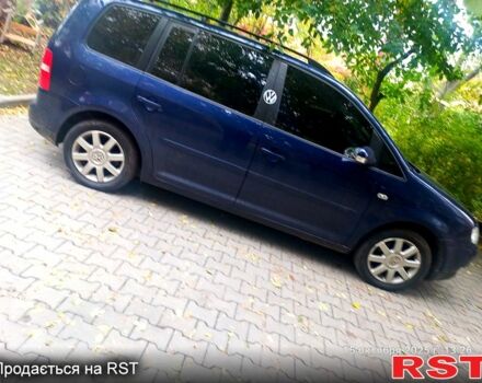Синий Фольксваген Туран, объемом двигателя 1.6 л и пробегом 220 тыс. км за 6299 $, фото 3 на Automoto.ua