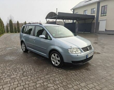 Синий Фольксваген Туран, объемом двигателя 1.6 л и пробегом 205 тыс. км за 5950 $, фото 1 на Automoto.ua