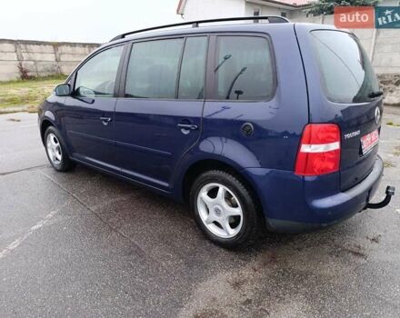 Синий Фольксваген Туран, объемом двигателя 1.6 л и пробегом 227 тыс. км за 5999 $, фото 1 на Automoto.ua