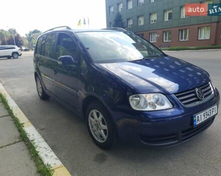 Синий Фольксваген Туран, объемом двигателя 1.4 л и пробегом 261 тыс. км за 6200 $, фото 2 на Automoto.ua