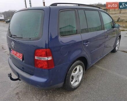 Синий Фольксваген Туран, объемом двигателя 1.6 л и пробегом 227 тыс. км за 5999 $, фото 3 на Automoto.ua