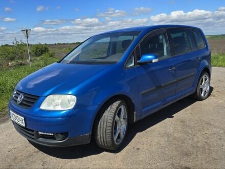 Синий Фольксваген Туран, объемом двигателя 1.6 л и пробегом 312 тыс. км за 5300 $, фото 1 на Automoto.ua