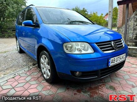 Синий Фольксваген Туран, объемом двигателя 2 л и пробегом 213 тыс. км за 5850 $, фото 1 на Automoto.ua