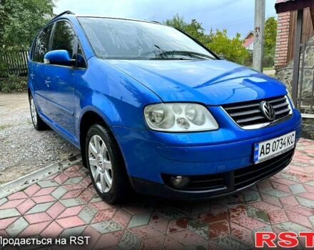 Синий Фольксваген Туран, объемом двигателя 2 л и пробегом 213 тыс. км за 5850 $, фото 1 на Automoto.ua