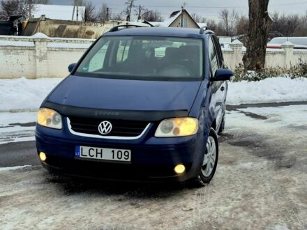 Синий Фольксваген Туран, объемом двигателя 2 л и пробегом 234 тыс. км за 2450 $, фото 1 на Automoto.ua