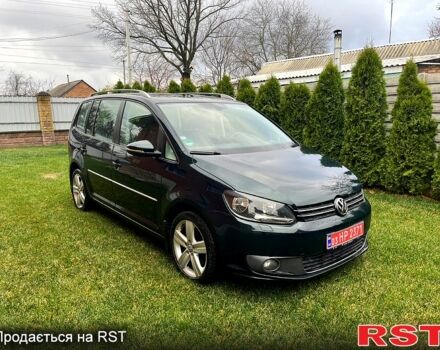 Зеленый Фольксваген Туран, объемом двигателя 2 л и пробегом 282 тыс. км за 10700 $, фото 1 на Automoto.ua