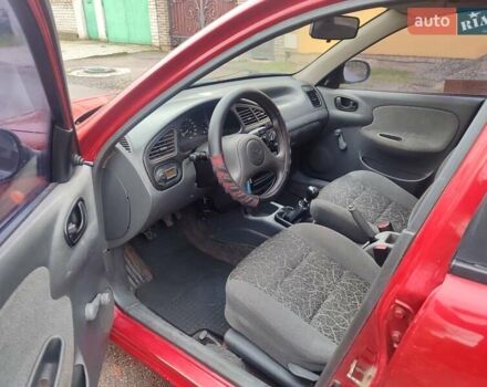 Красный ЗАЗ Ланос, объемом двигателя 1.39 л и пробегом 254 тыс. км за 1500 $, фото 7 на Automoto.ua