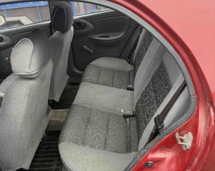 Красный ЗАЗ Ланос, объемом двигателя 1.4 л и пробегом 270 тыс. км за 1150 $, фото 6 на Automoto.ua