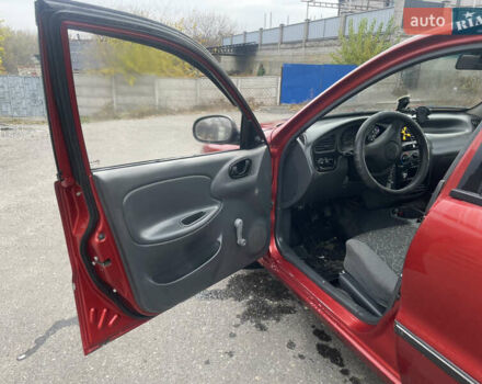 Красный ЗАЗ Ланос, объемом двигателя 1.39 л и пробегом 180 тыс. км за 1750 $, фото 7 на Automoto.ua