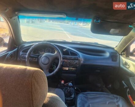 Сірий ЗАЗ Ланос, об'ємом двигуна 1.39 л та пробігом 280 тис. км за 2000 $, фото 4 на Automoto.ua