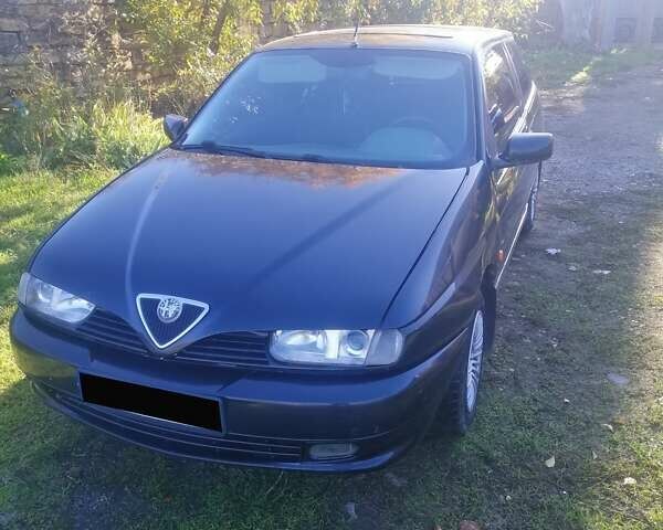 Черный Альфа Ромео 145, объемом двигателя 1.4 л и пробегом 285 тыс. км за 1700 $, фото 1 на Automoto.ua