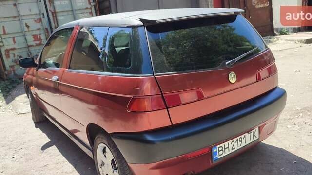 Красный Альфа Ромео 145, объемом двигателя 1.6 л и пробегом 237 тыс. км за 1599 $, фото 1 на Automoto.ua