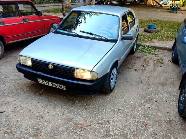 Сірий Альфа Ромео 33, об'ємом двигуна 1.6 л та пробігом 425 тис. км за 800 $, фото 1 на Automoto.ua