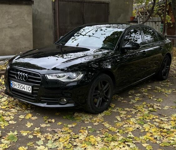 Черный Ауди А6, объемом двигателя 2 л и пробегом 230 тыс. км за 14600 $, фото 1 на Automoto.ua
