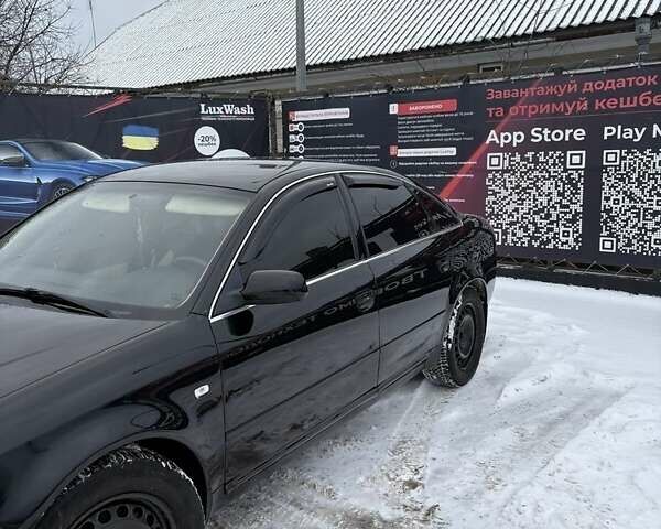 Черный Ауди А6, объемом двигателя 1.8 л и пробегом 285 тыс. км за 4650 $, фото 1 на Automoto.ua