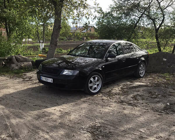 Черный Ауди А6, объемом двигателя 2.39 л и пробегом 357 тыс. км за 4000 $, фото 1 на Automoto.ua