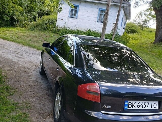 Черный Ауди А6, объемом двигателя 2.39 л и пробегом 270 тыс. км за 4100 $, фото 1 на Automoto.ua