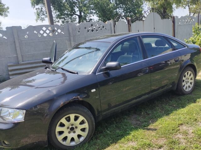 Черный Ауди А6, объемом двигателя 2.5 л и пробегом 405 тыс. км за 7000 $, фото 1 на Automoto.ua