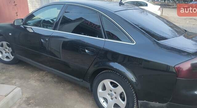 Чорний Ауді А6, об'ємом двигуна 2 л та пробігом 265 тис. км за 3700 $, фото 1 на Automoto.ua
