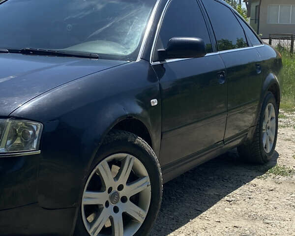 Черный Ауди А6, объемом двигателя 2.5 л и пробегом 395 тыс. км за 4000 $, фото 1 на Automoto.ua