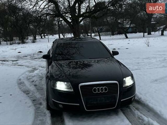 Черный Ауди А6, объемом двигателя 2.4 л и пробегом 295 тыс. км за 6500 $, фото 1 на Automoto.ua