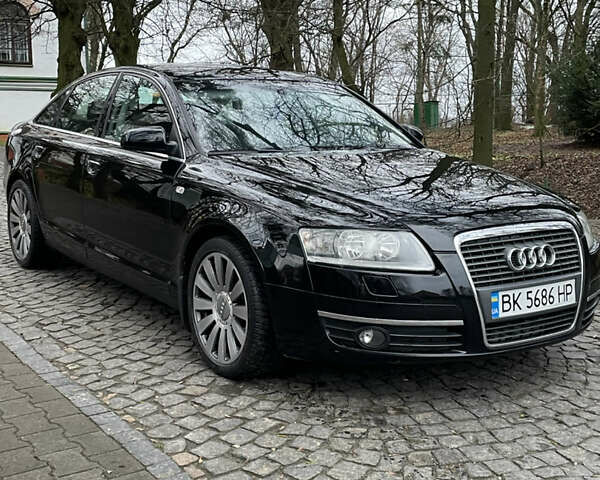 Черный Ауди А6, объемом двигателя 2 л и пробегом 248 тыс. км за 7600 $, фото 1 на Automoto.ua